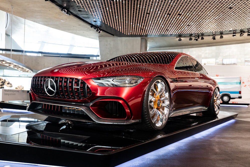 a red car on display in a building