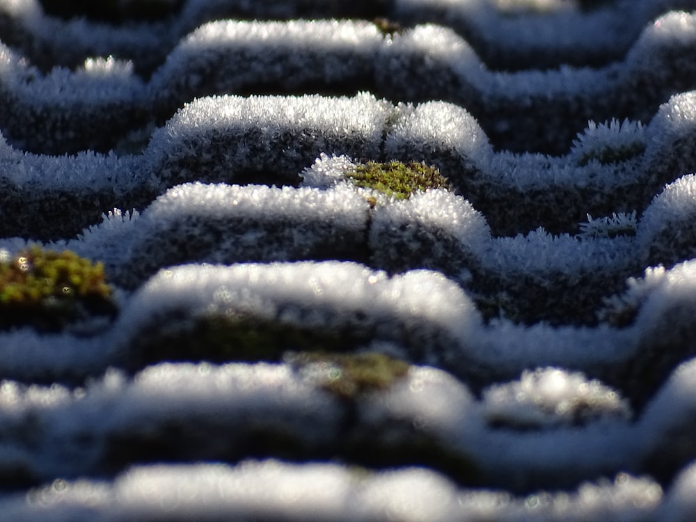 a close up of a snow covered tire tread