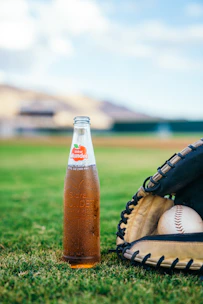 Close-up of travel baseball essentials like water bottles, snacks, and first aid kit.