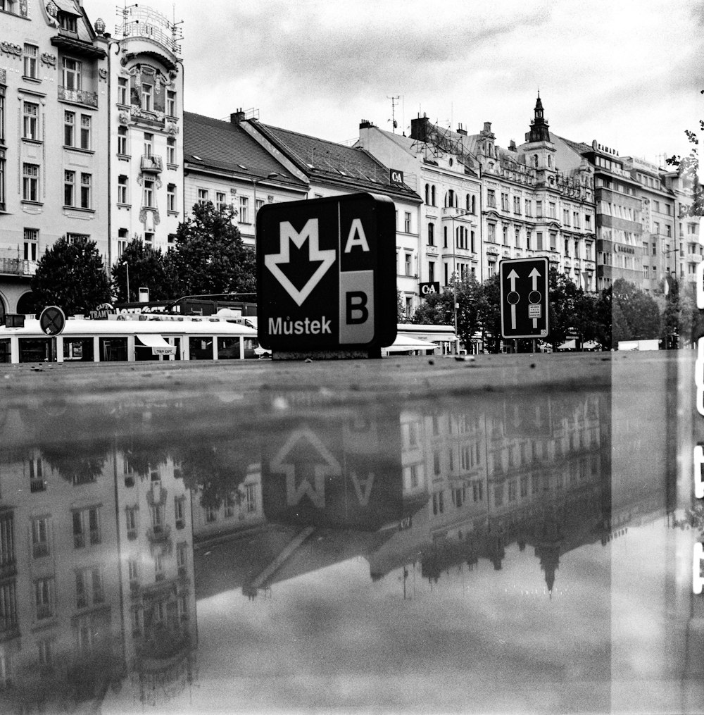 a black and white photo of a street sign