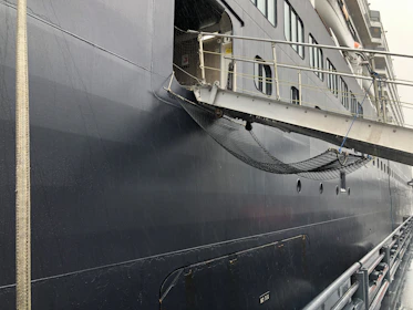 Close-up of African security personnel coordinating safety checks on a vessel deck.