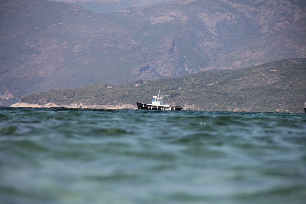 a boat is in the middle of a body of water