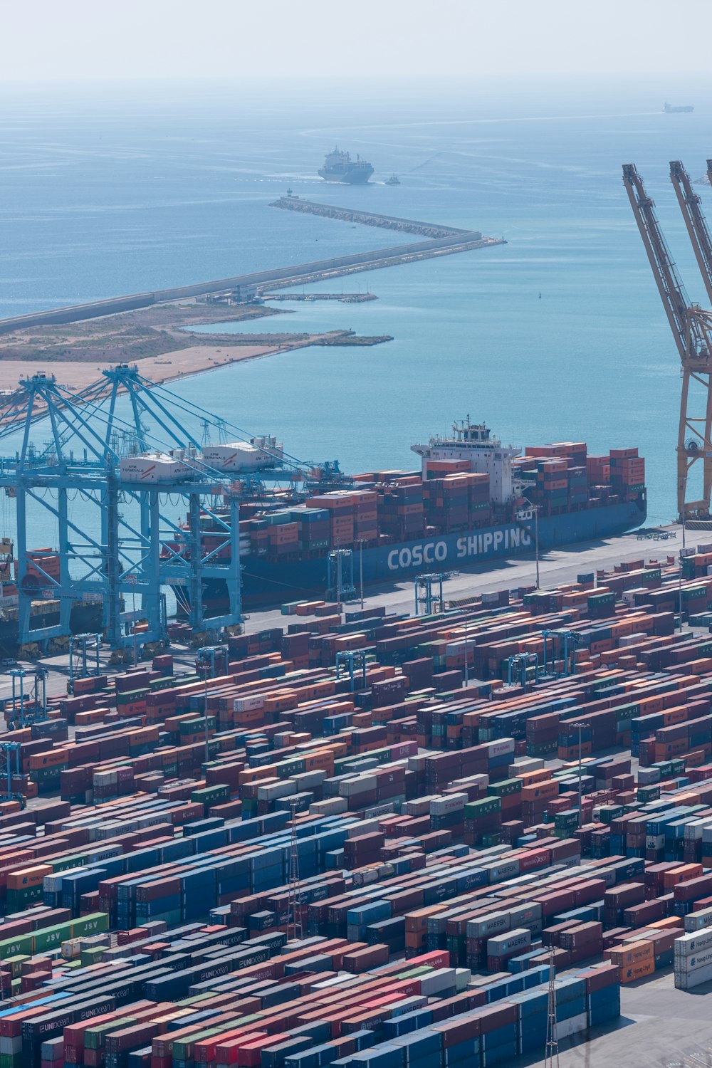 a large cargo ship docked at a port