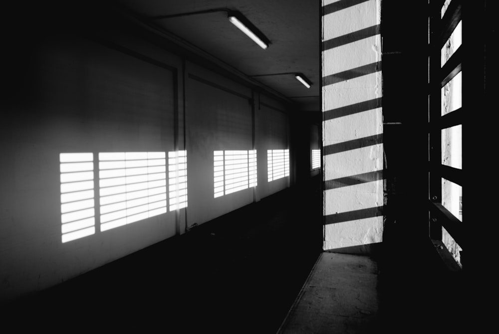 a black and white photo of a hallway