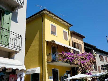 A vibrant street scene in Acatzingo, Puebla, capturing colorful buildings and lively local life under a bright sky.