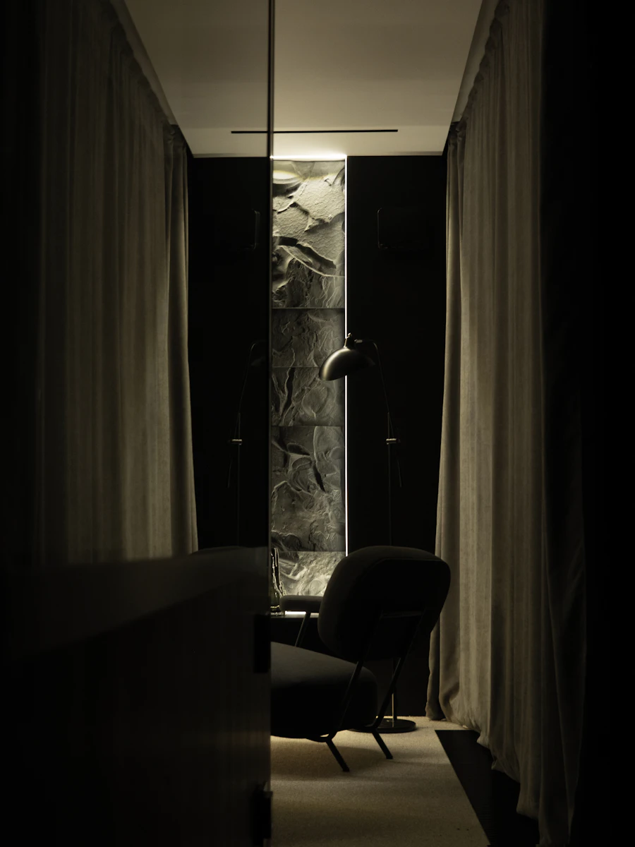 Lamplit vignette seen through a dark doorway (placeholder photograph)