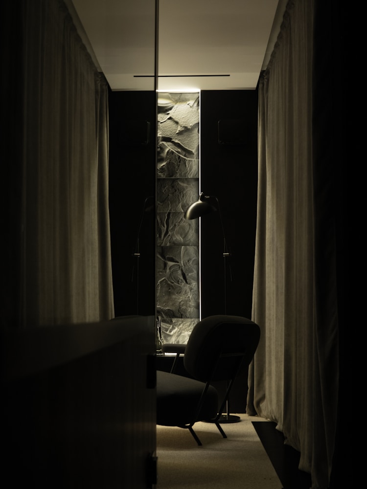 Lined curtains against a marble reveal