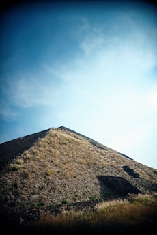 A striking view of the Great Pyramid of Egypt under a clear blue sky, symbolizing the foundation of the gopyra economic theory.