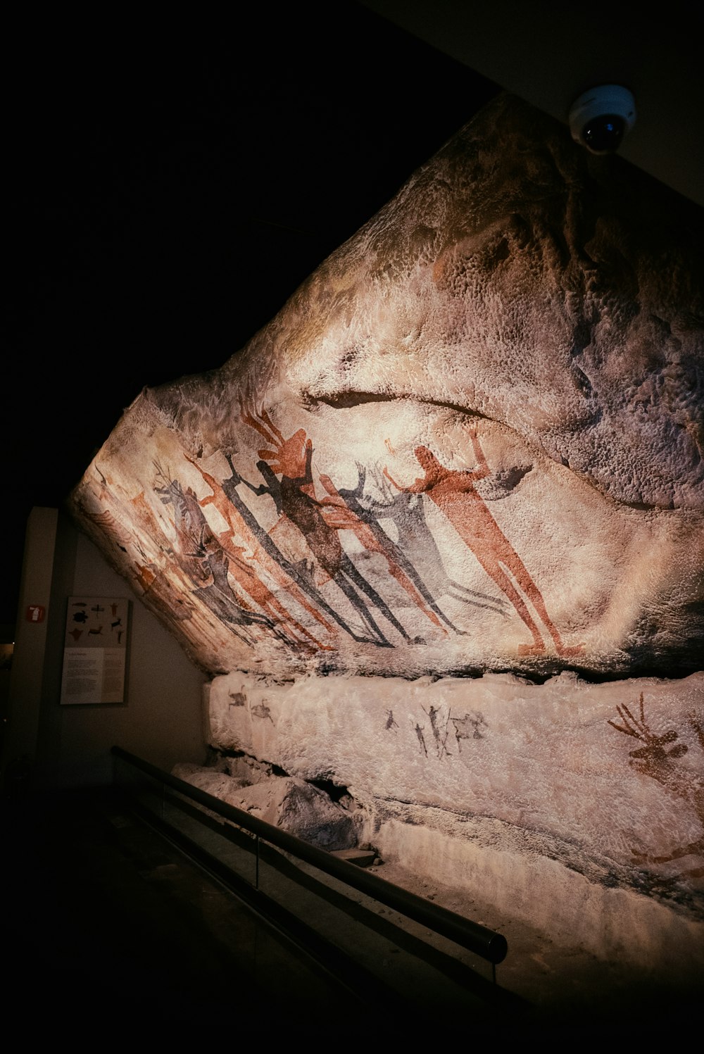 a close up of a rock with paintings on it