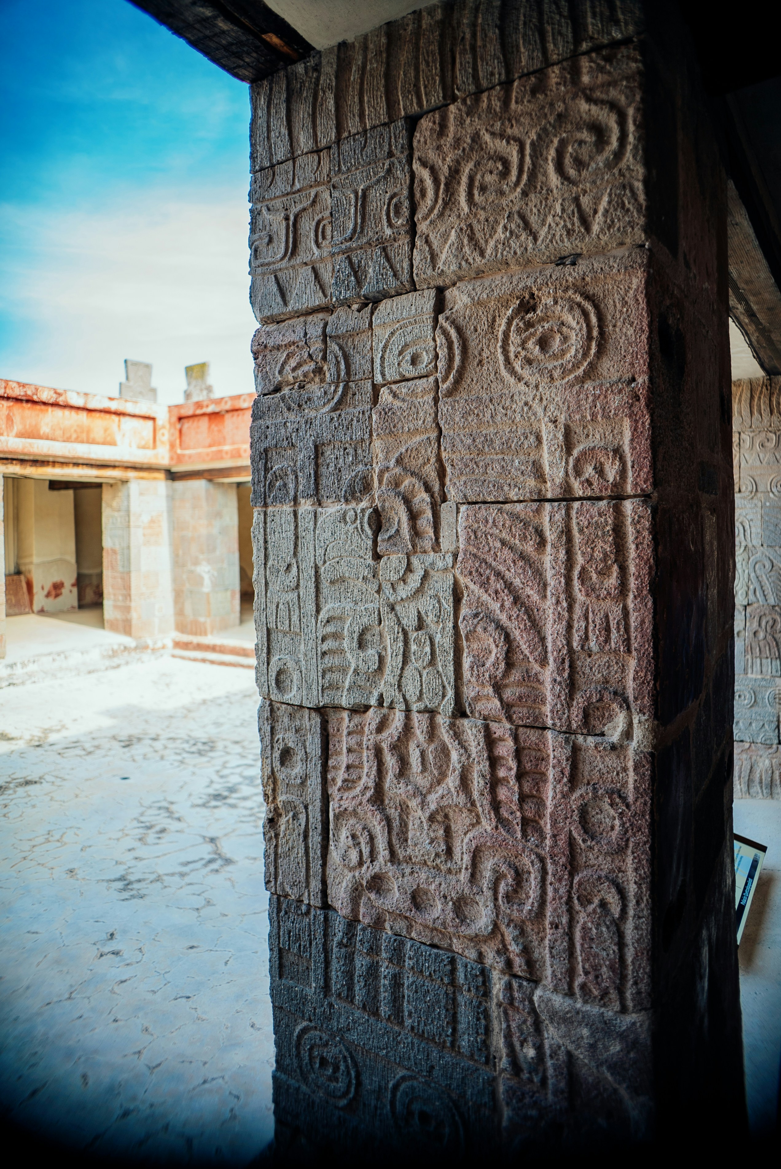 a close up of a stone pillar with carvings on it