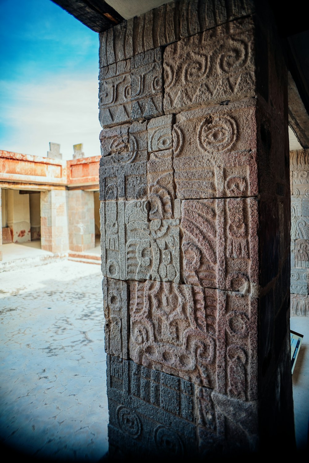 a close up of a stone pillar with carvings on it