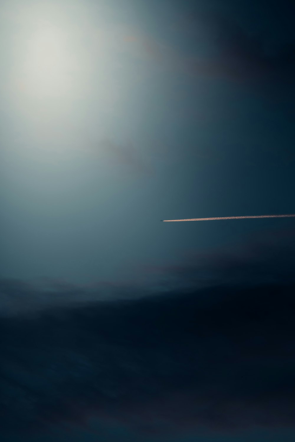 an airplane is flying in the sky at night