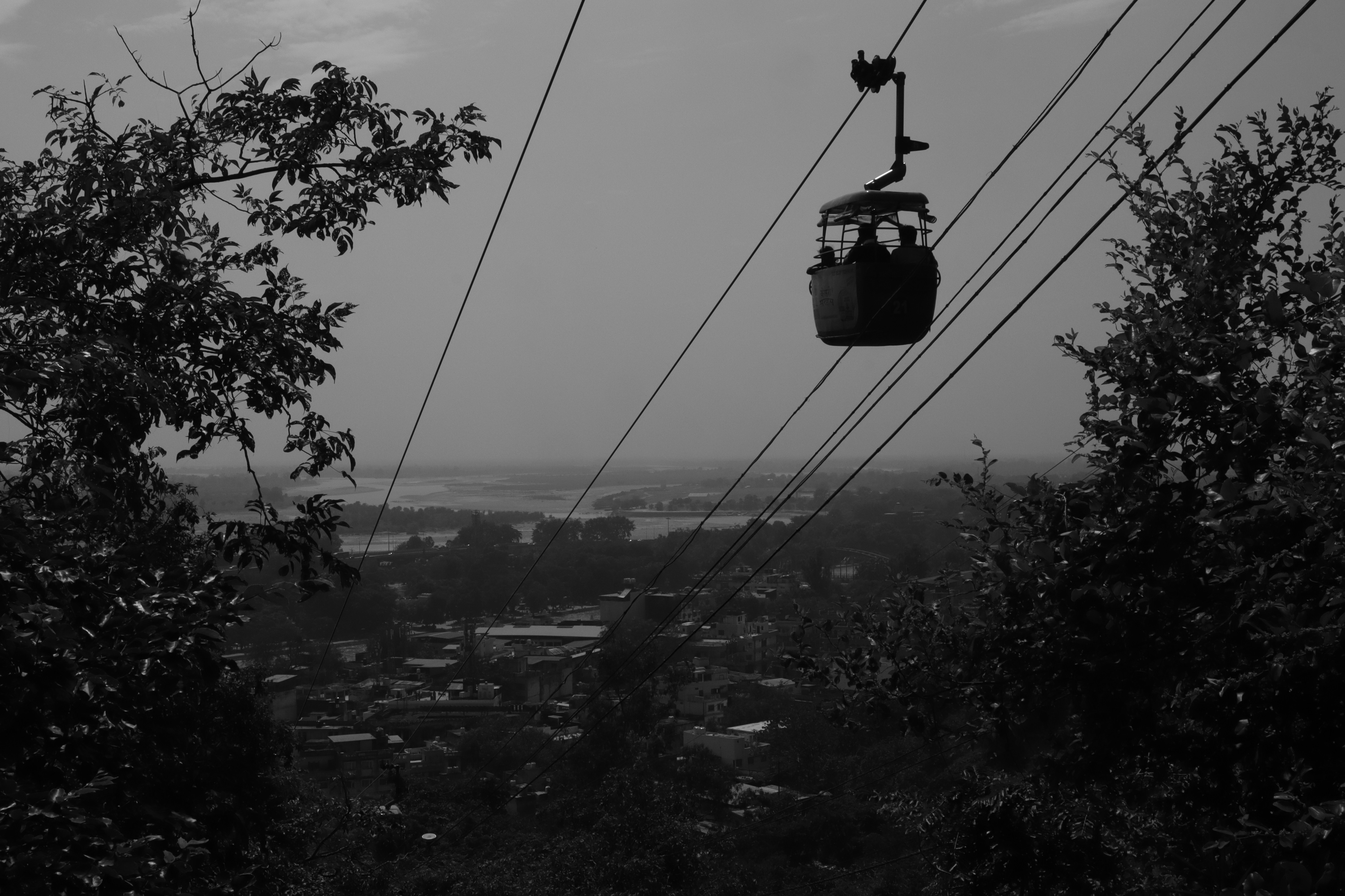 a black and white photo of a cable car