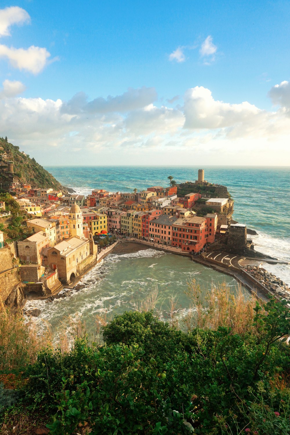 a scenic view of a small town by the ocean