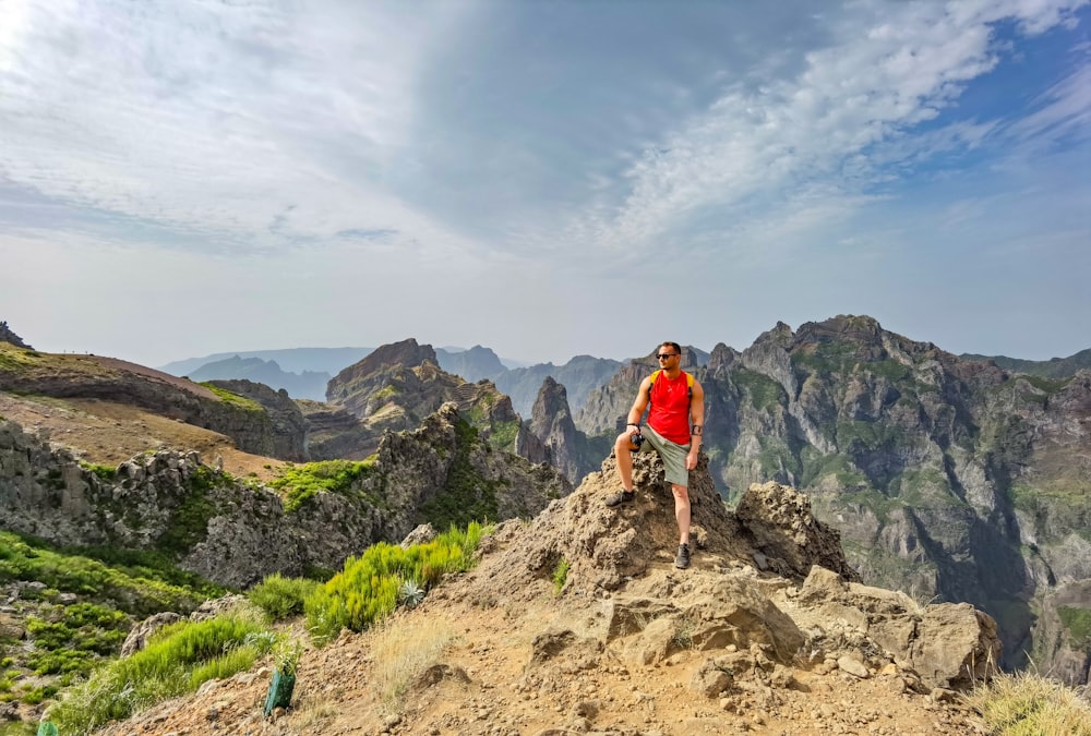 a man standing on top of a mountain