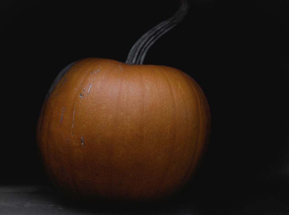 a close up of a pumpkin on a table