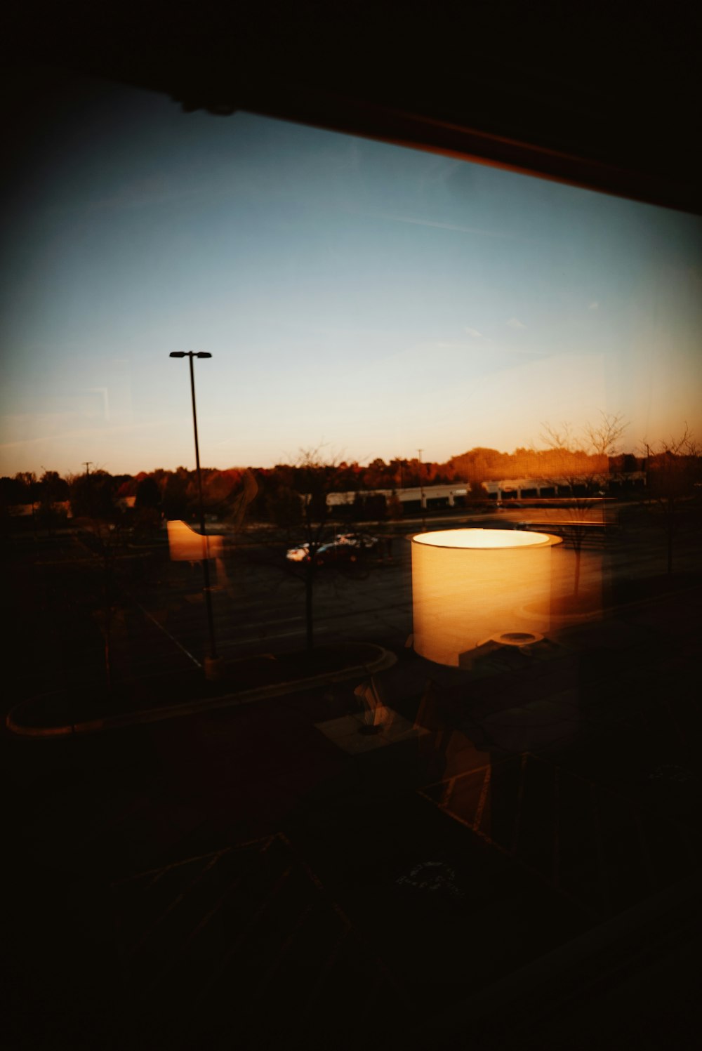 a view of a parking lot through a window