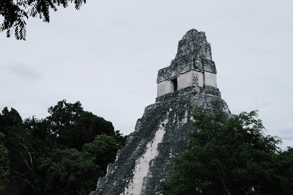 a very tall pyramid with a clock on top of it