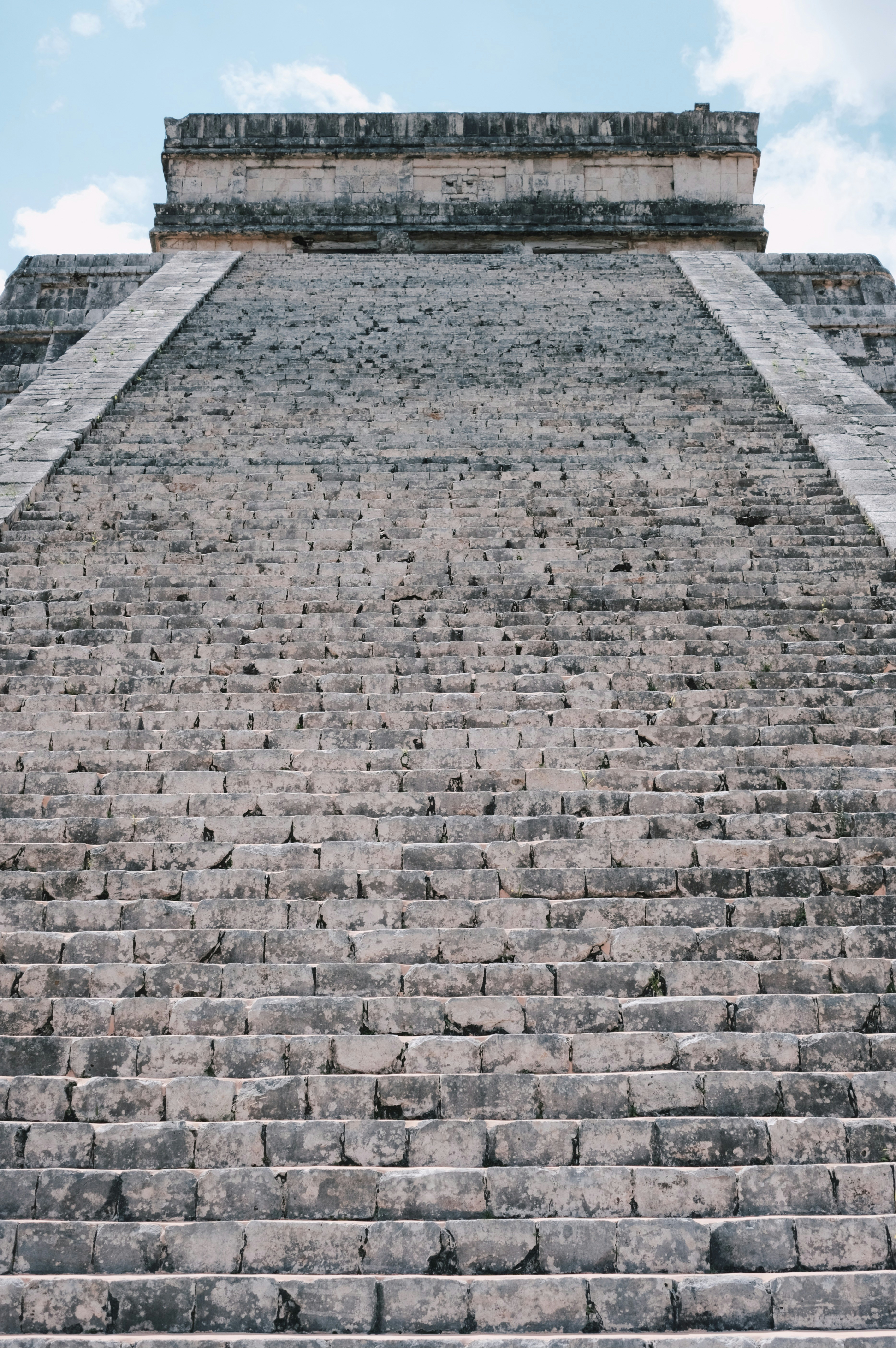 a very tall pyramid with a clock on top of it