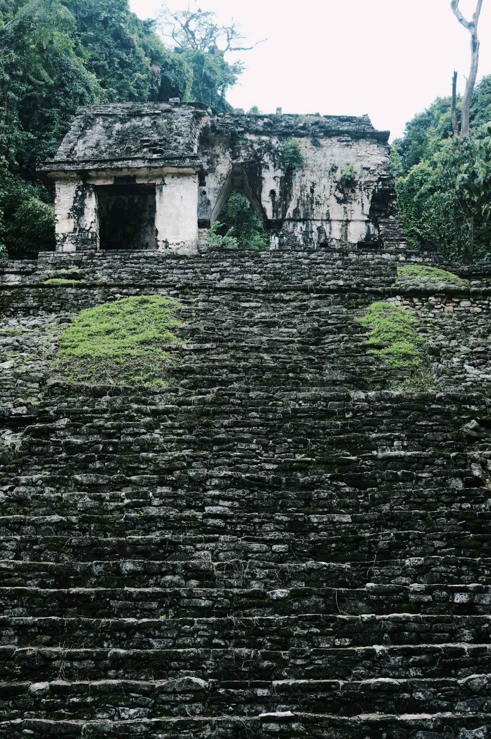 a stone structure with steps leading up to it