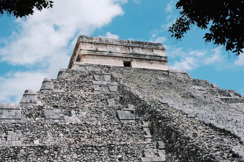 a large stone structure with a sky background