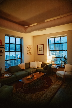 a living room filled with furniture and a fire place