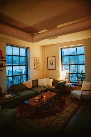 a living room filled with furniture and a fire place