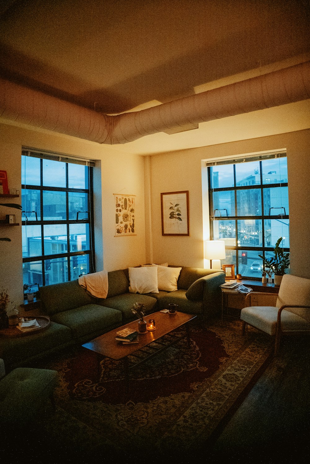 a living room filled with furniture and a fire place