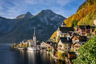 a scenic view of a town on a lake