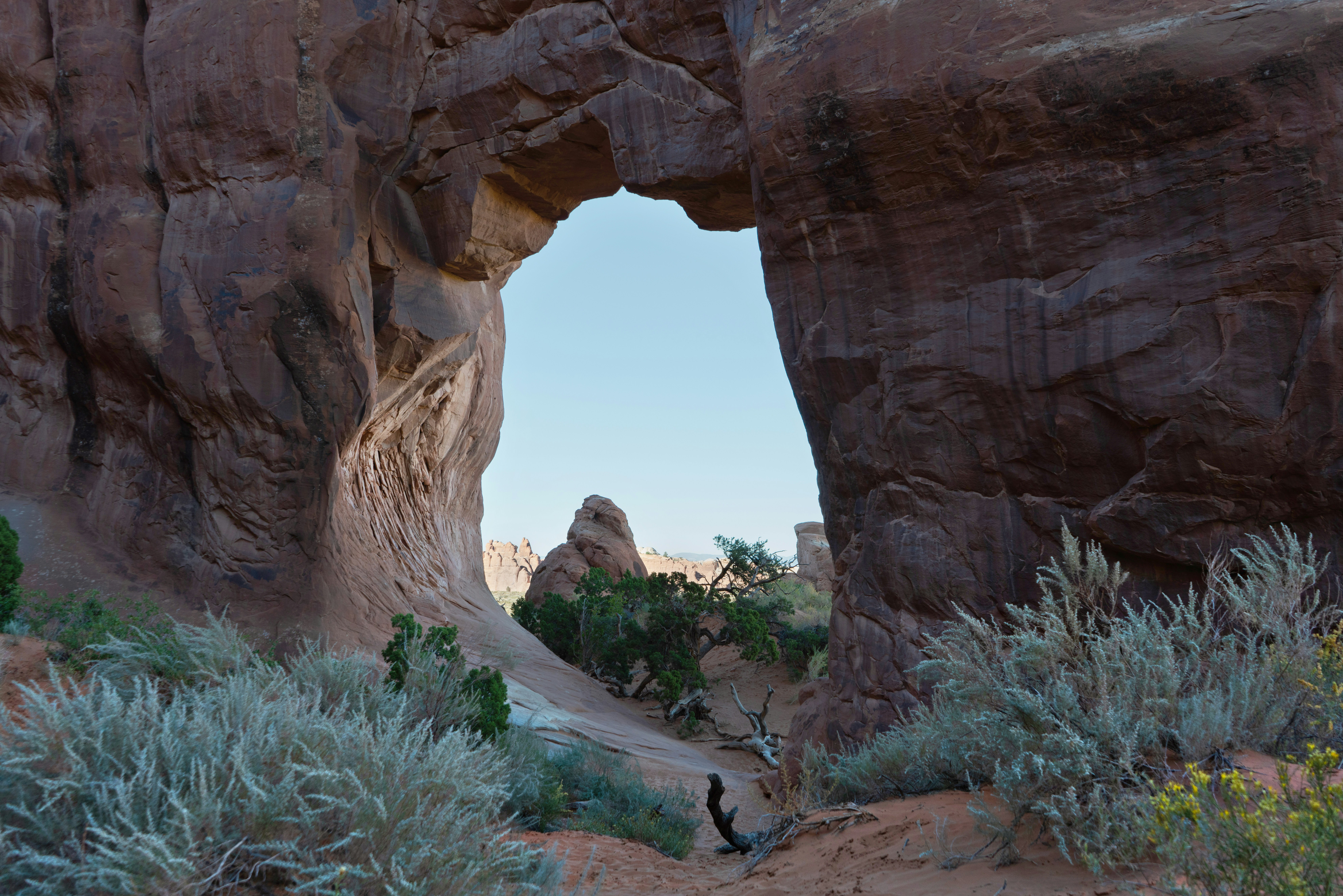 a large rock formation with a hole in the middle of it
