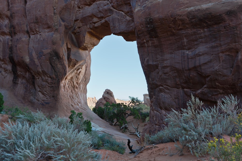 a large rock formation with a hole in the middle of it