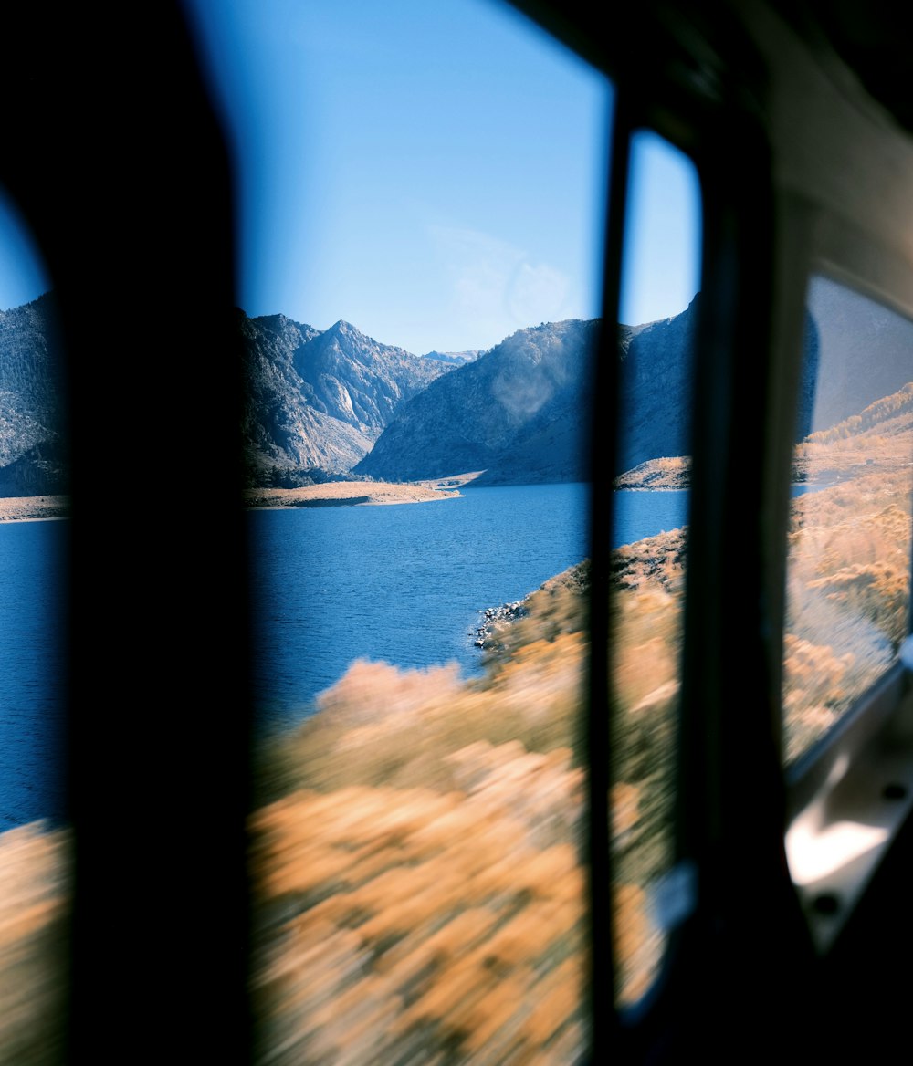 a view of a body of water from inside a vehicle