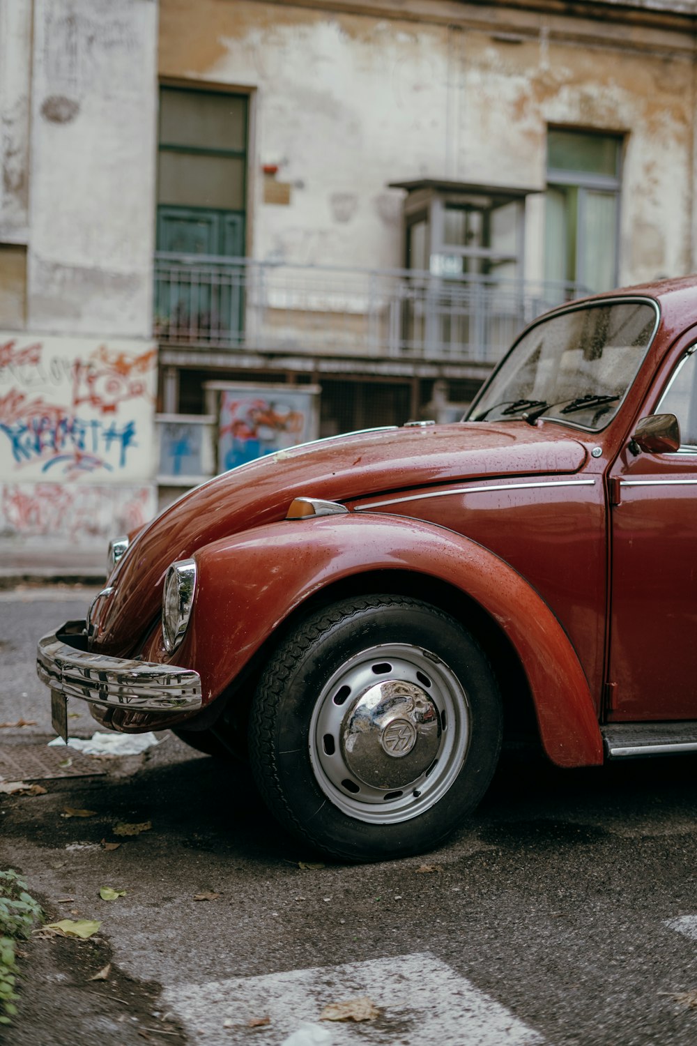 a red car parked on the side of the road