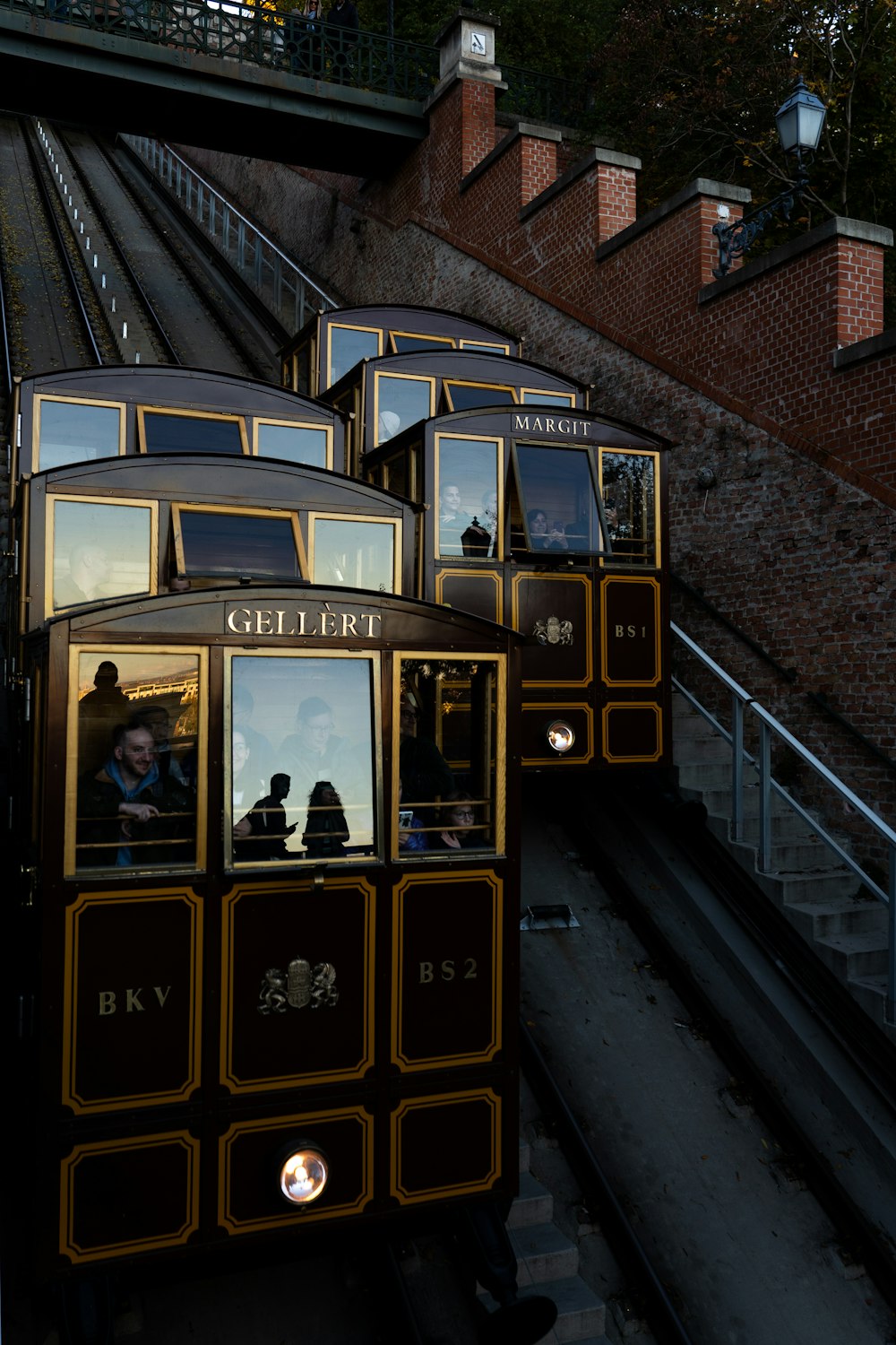 a group of people riding on the back of a train