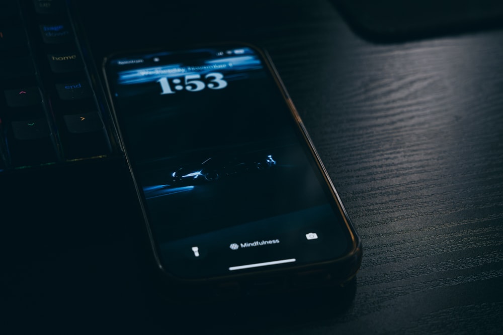 a close up of a cell phone on a table