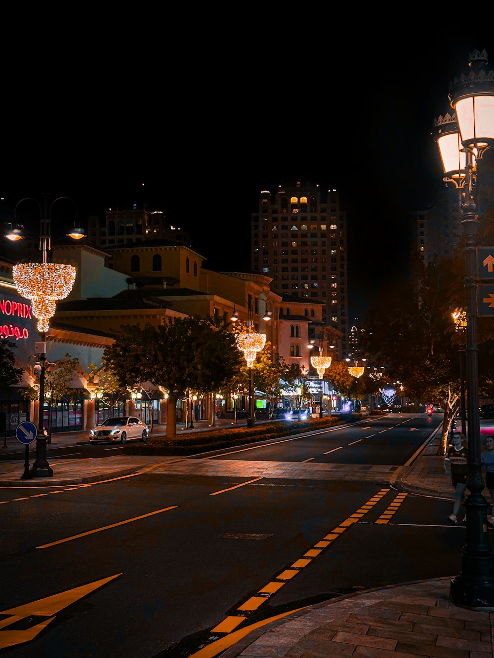 a city street at night with a street light