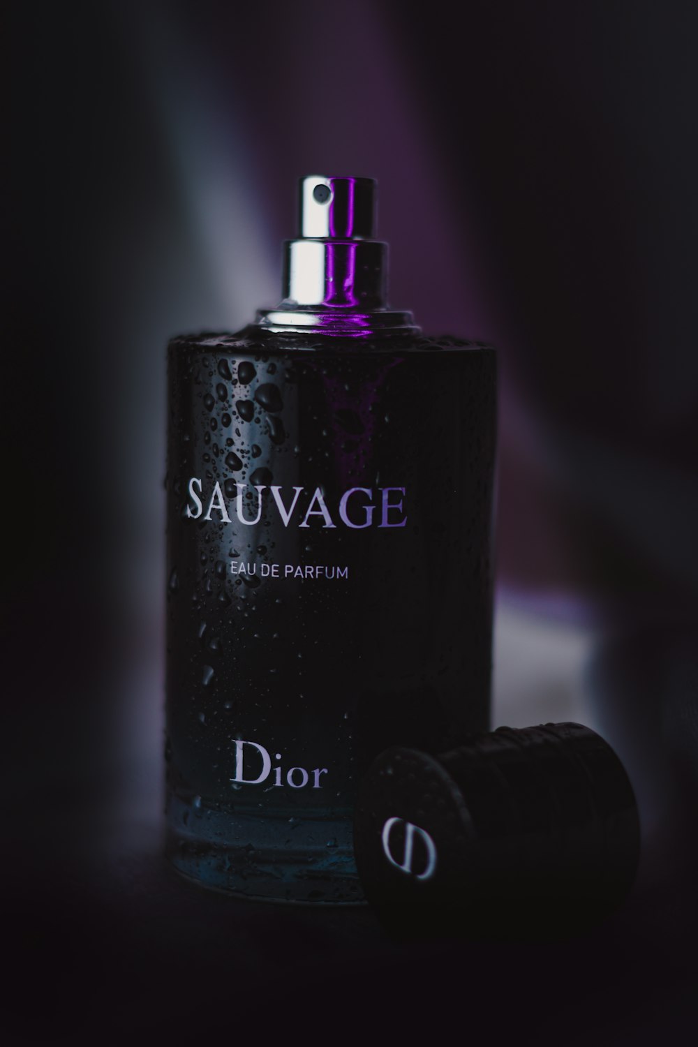 a bottle of dior sauvage on a table