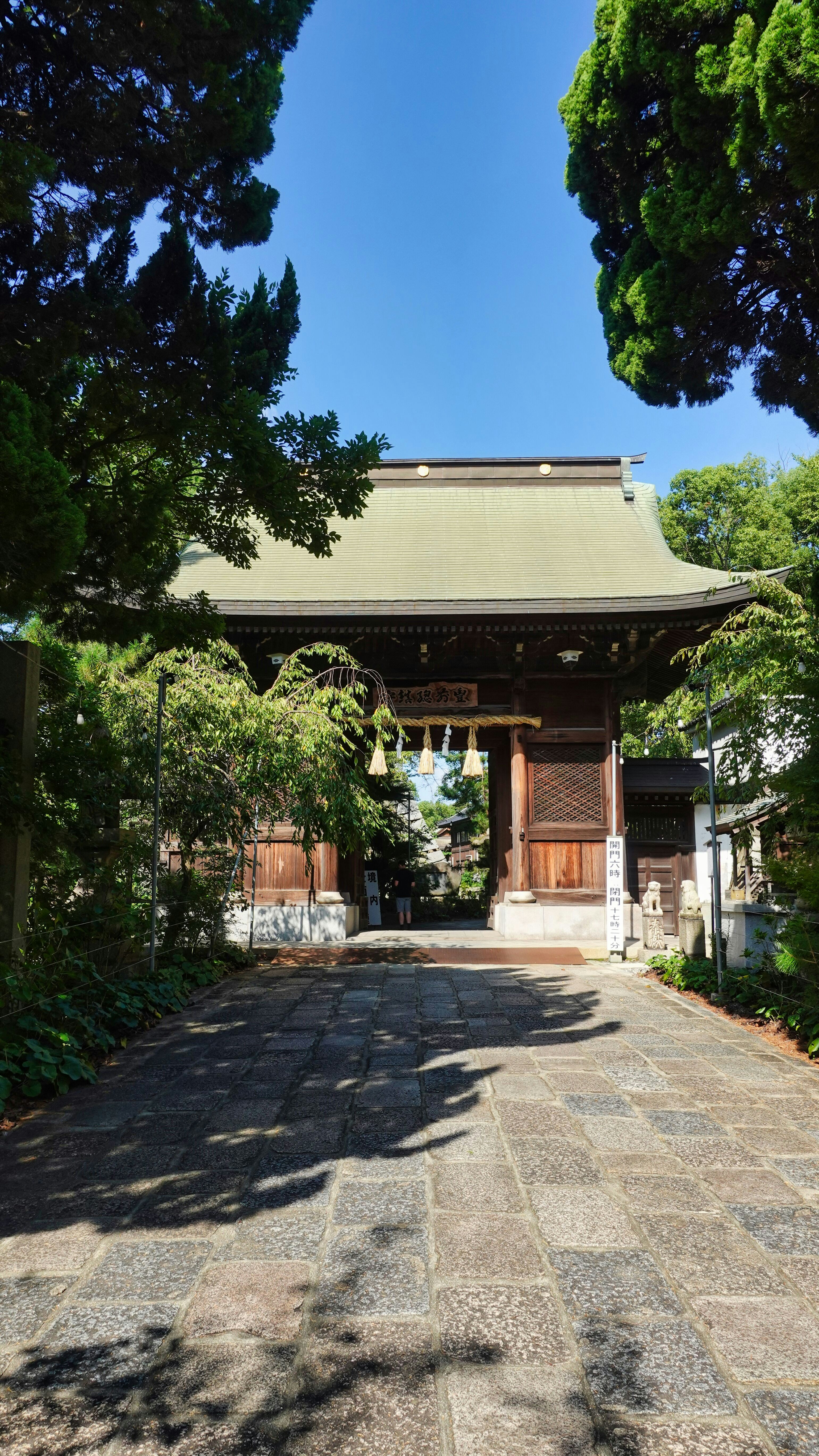 a small building with a gate in the middle of it