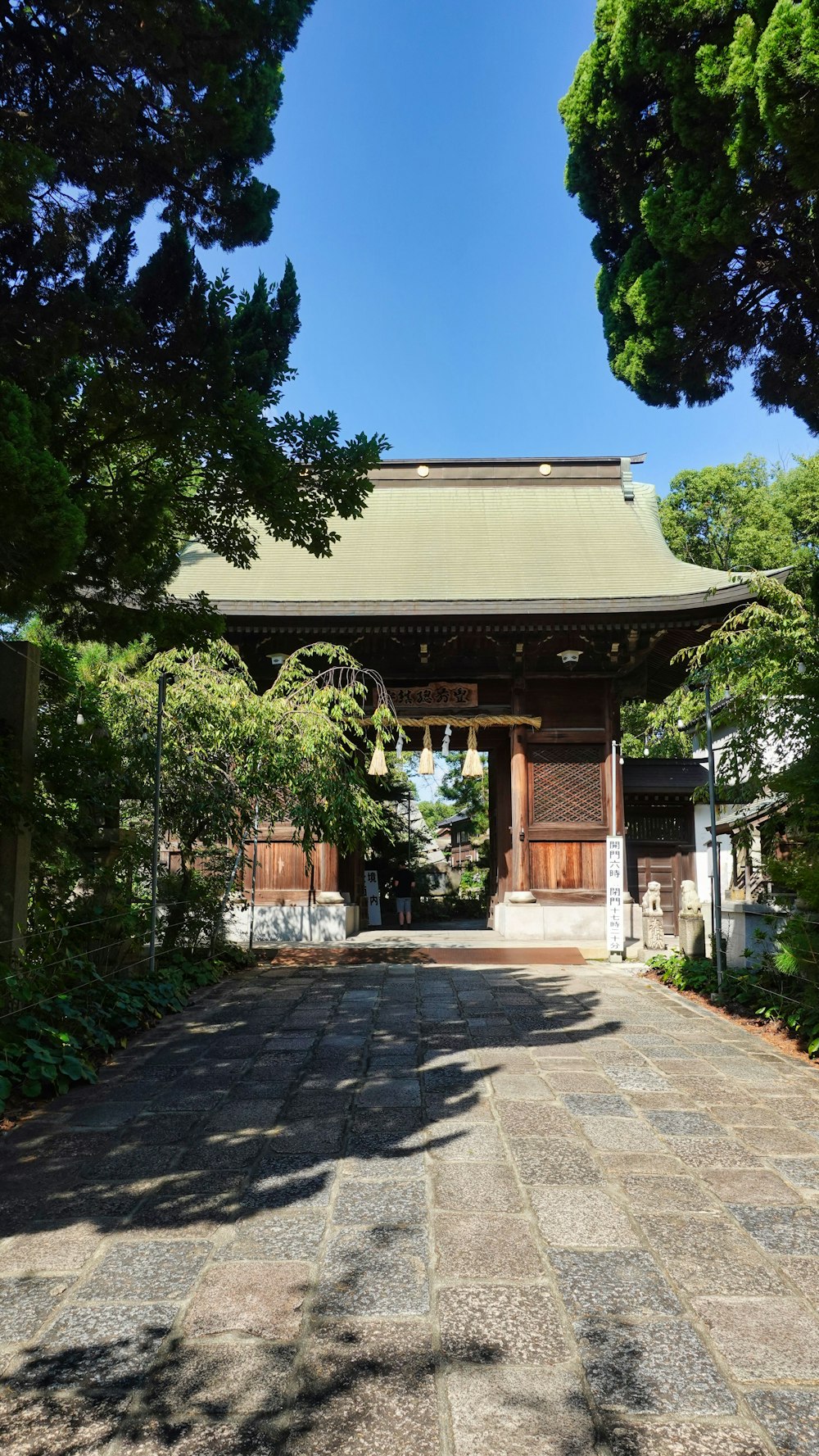 a small building with a gate in the middle of it