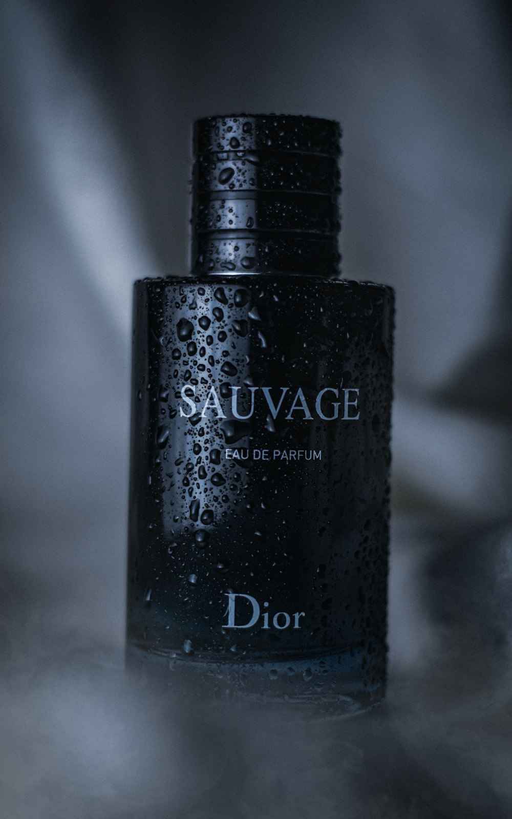a bottle of dior sauvage on a table