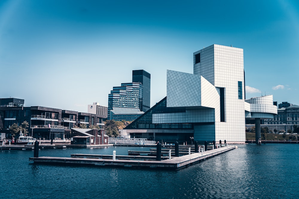 a large body of water with buildings in the background