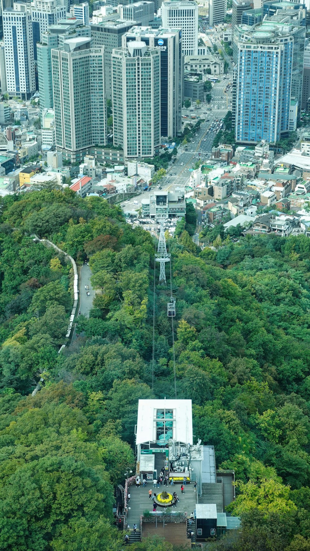 an aerial view of a city with tall buildings