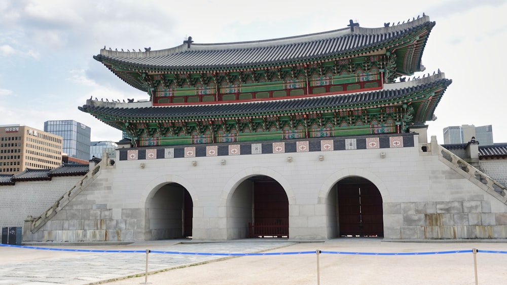 a tall building with a lot of arches in front of it