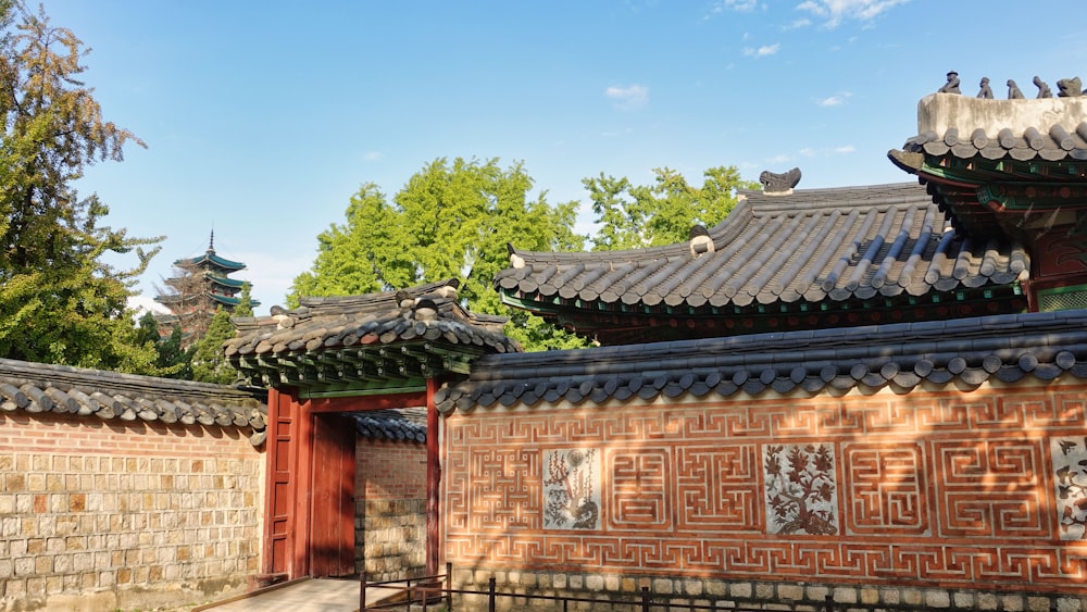 a building with a lot of windows and roof tiles