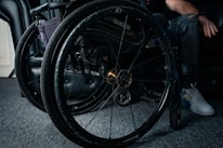 Close-up of donated wheelchairs lined up waiting for distribution.