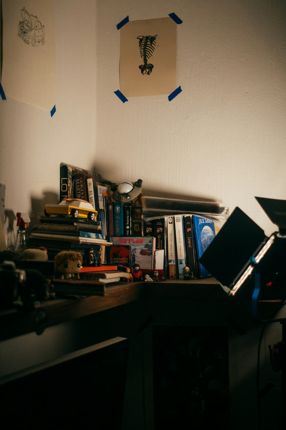 a laptop computer sitting on top of a wooden desk