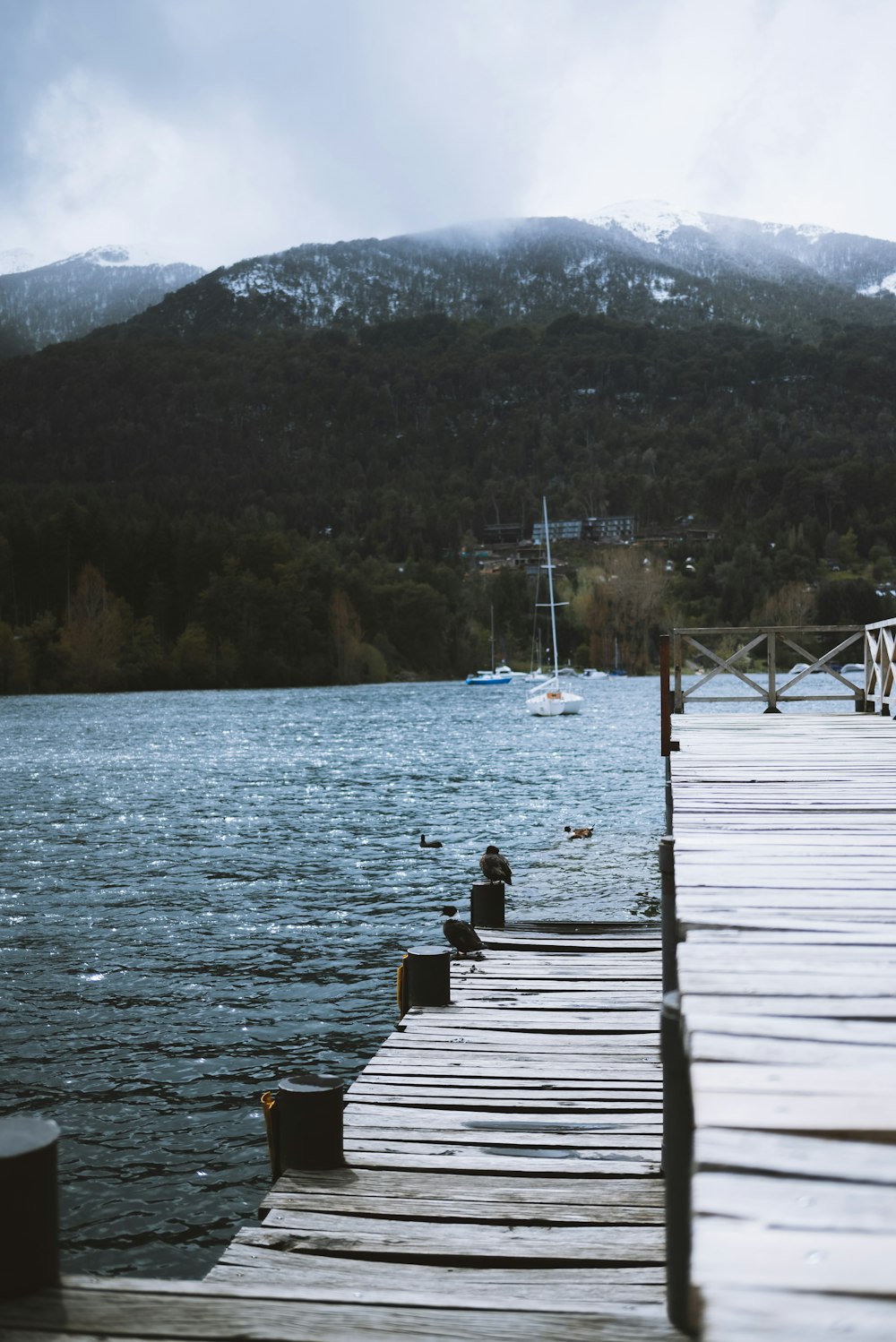 a wooden dock sitting next to a body of water