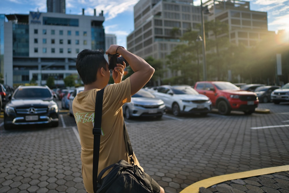 a man taking a picture of a parking lot