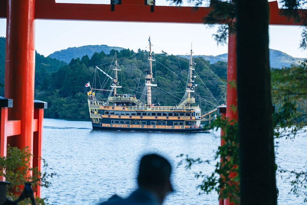 a large boat floating on top of a body of water