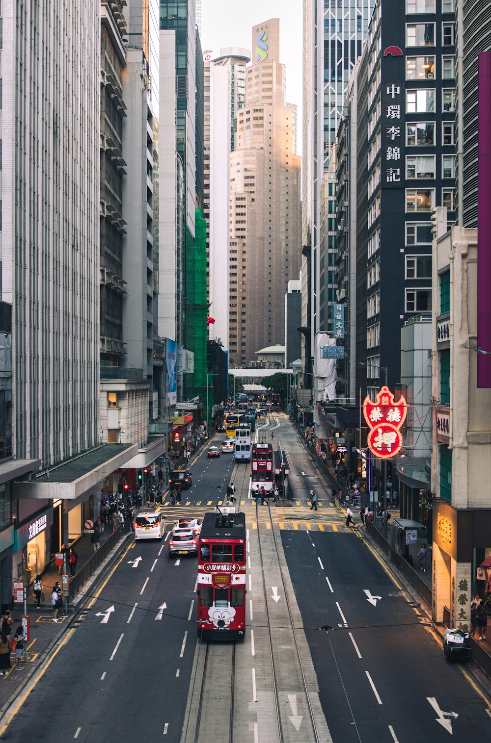 a city street filled with lots of tall buildings